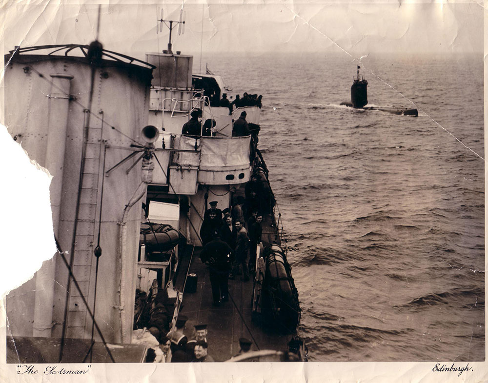 U-2361 rounding the stern of HMS Vivien on Sunday 13 May 1945
