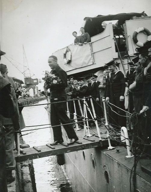 CO with flowers coming ashore