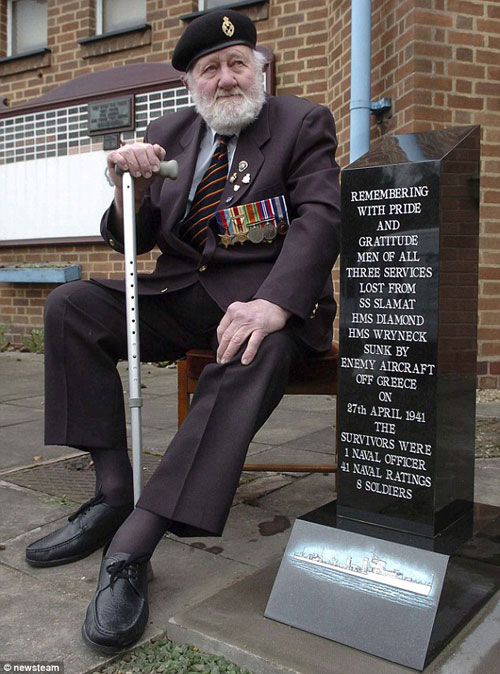 George Dexter with memorial to those who died on 27 April 1942